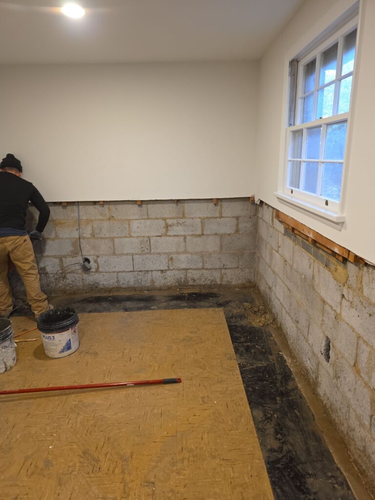 Interior Drainage Systems Baltimore installation showing the basement perimeter trench opened to relieve hydrostatic pressure before drainage system installation.